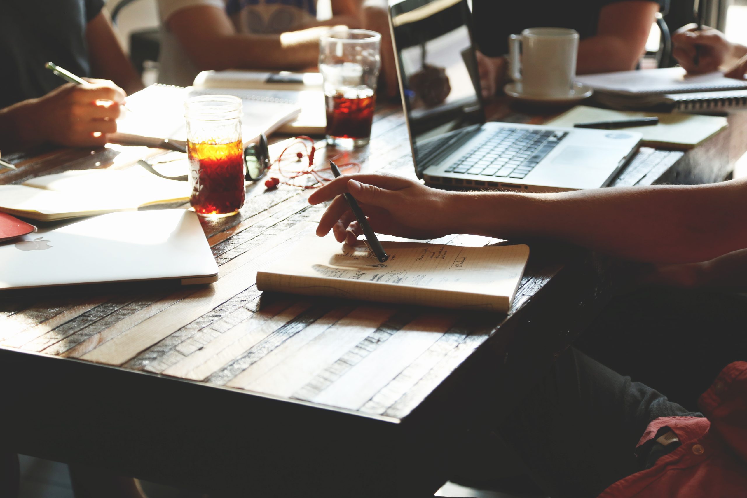 Desk with coffee and documents during meeting