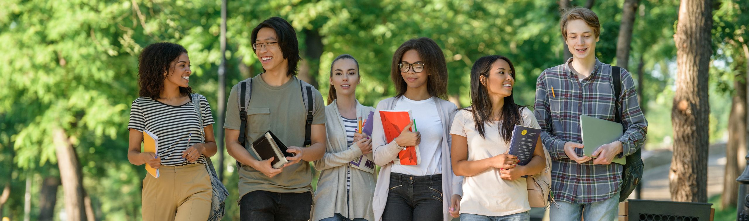 Happy students walking while talking