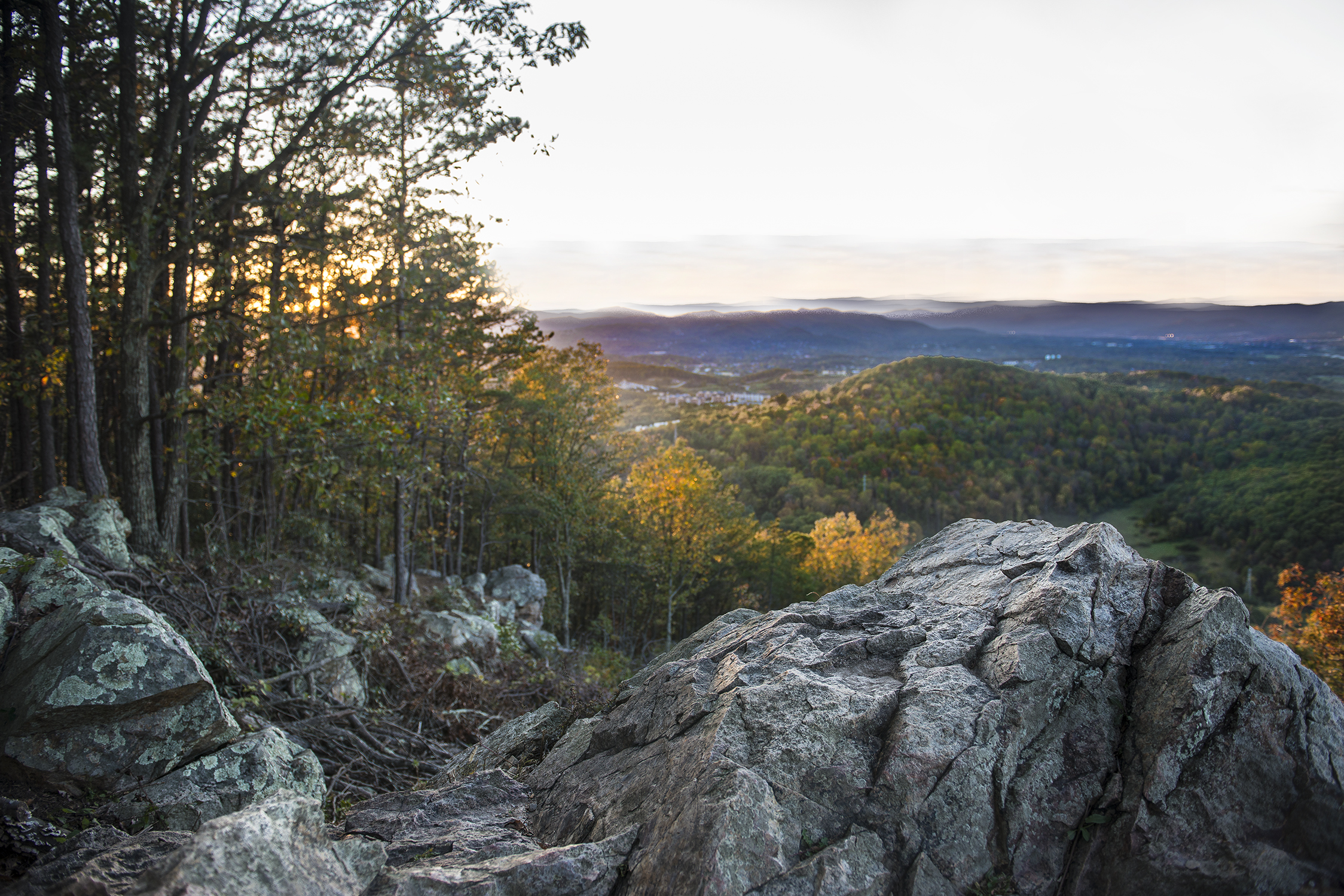 Rocky overlook with forested valley view