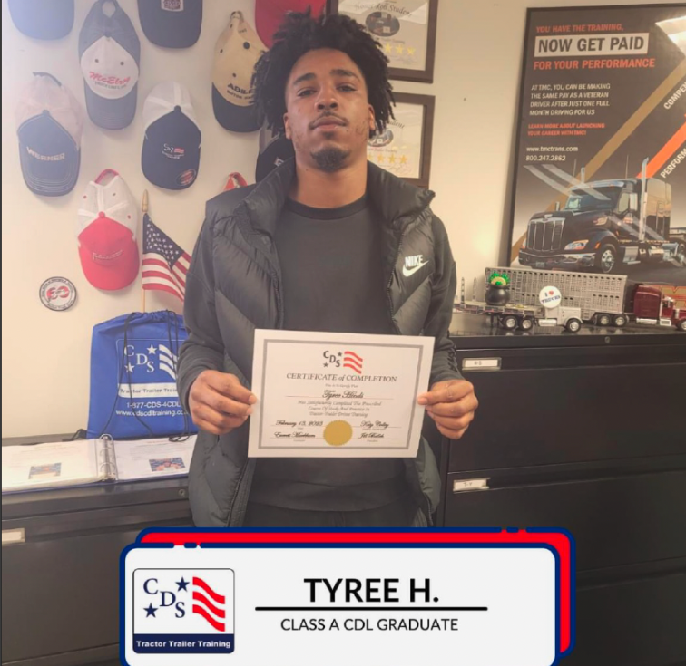 Man holding completion certificate indoors