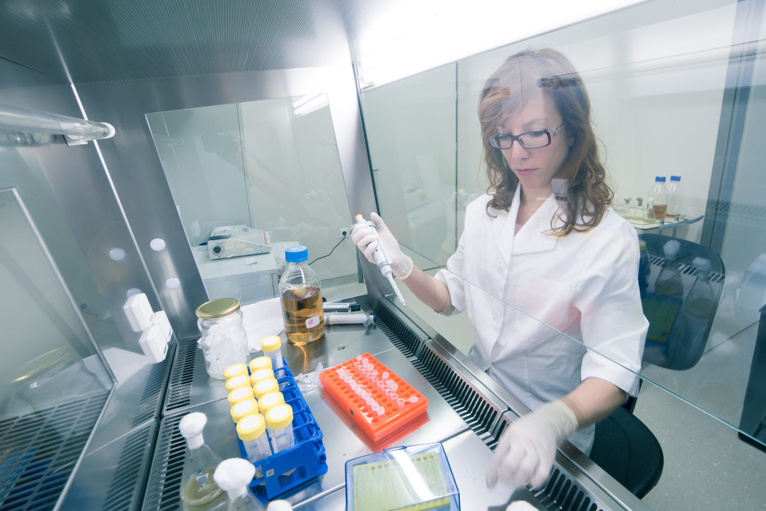 Scientist working in a laboratory with test tubes
