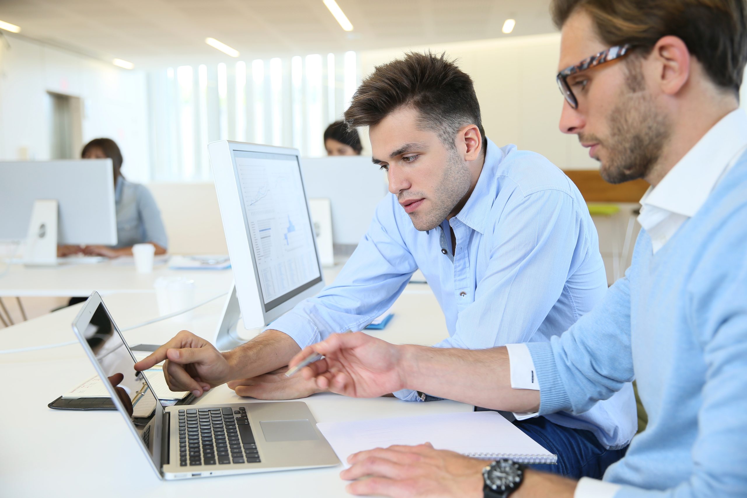 Office team collaborating at computers