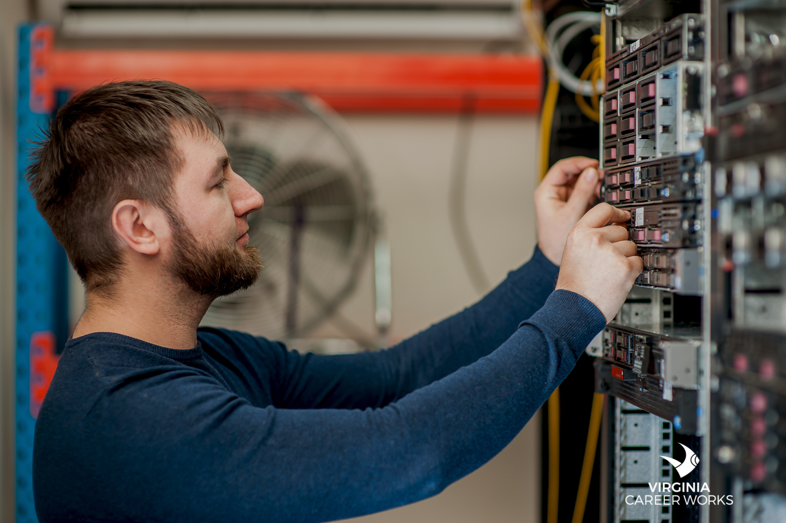 Technician installing or maintaining server equipment
