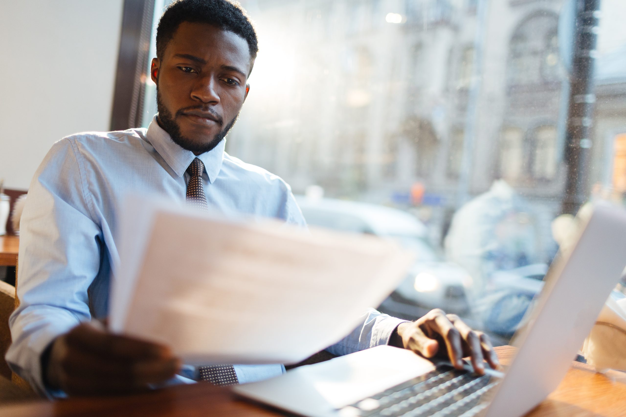 Professional man reviewing paperwork at a desk