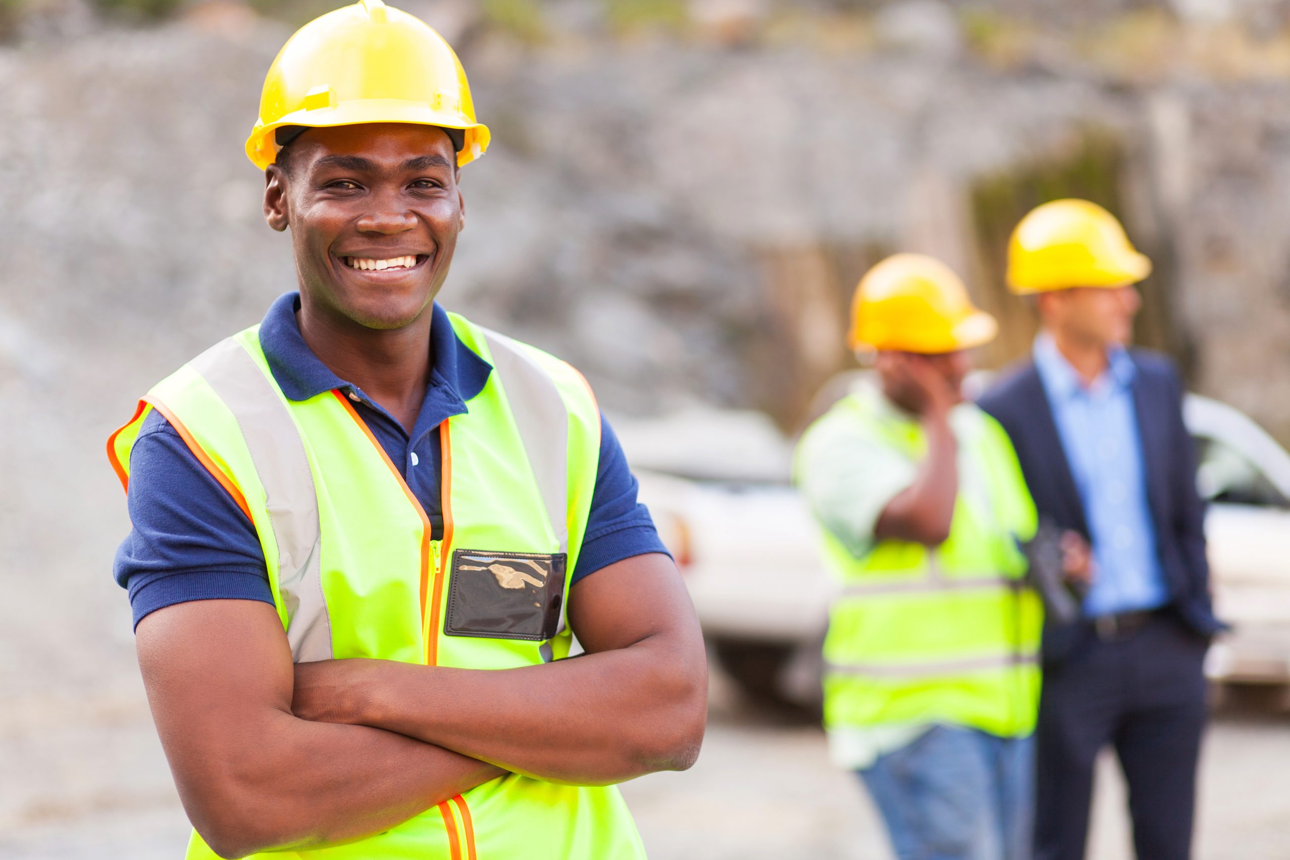 Construction worker smiling in safety gear